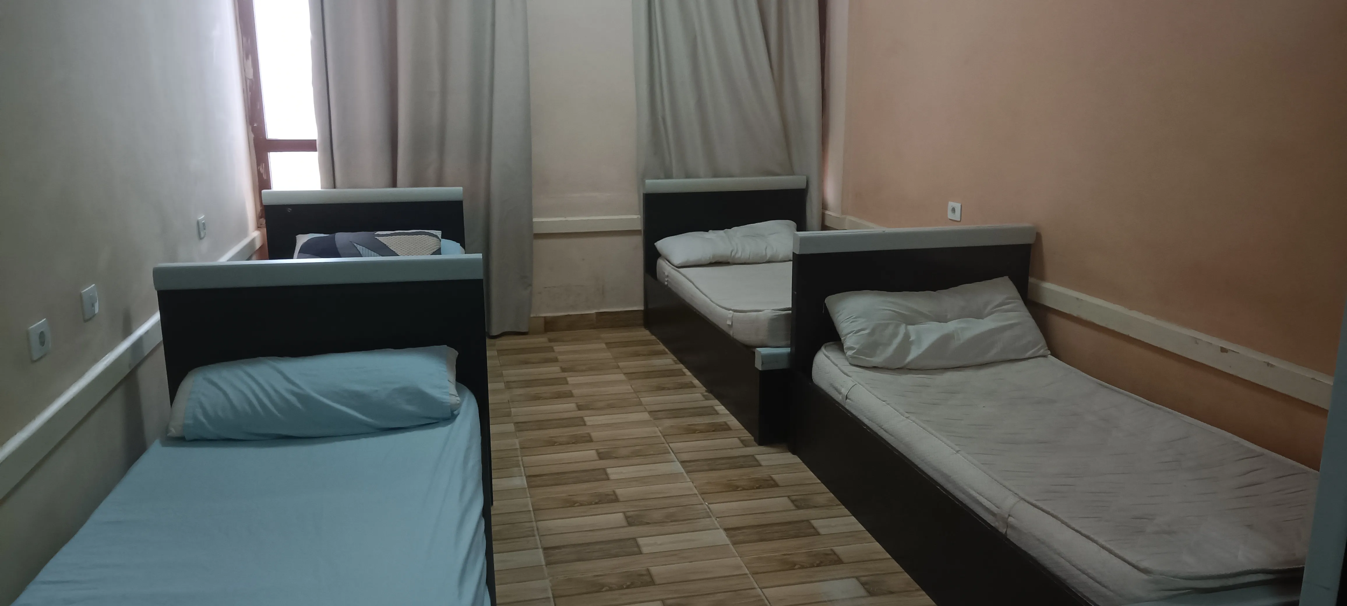Residential room with beds and storage